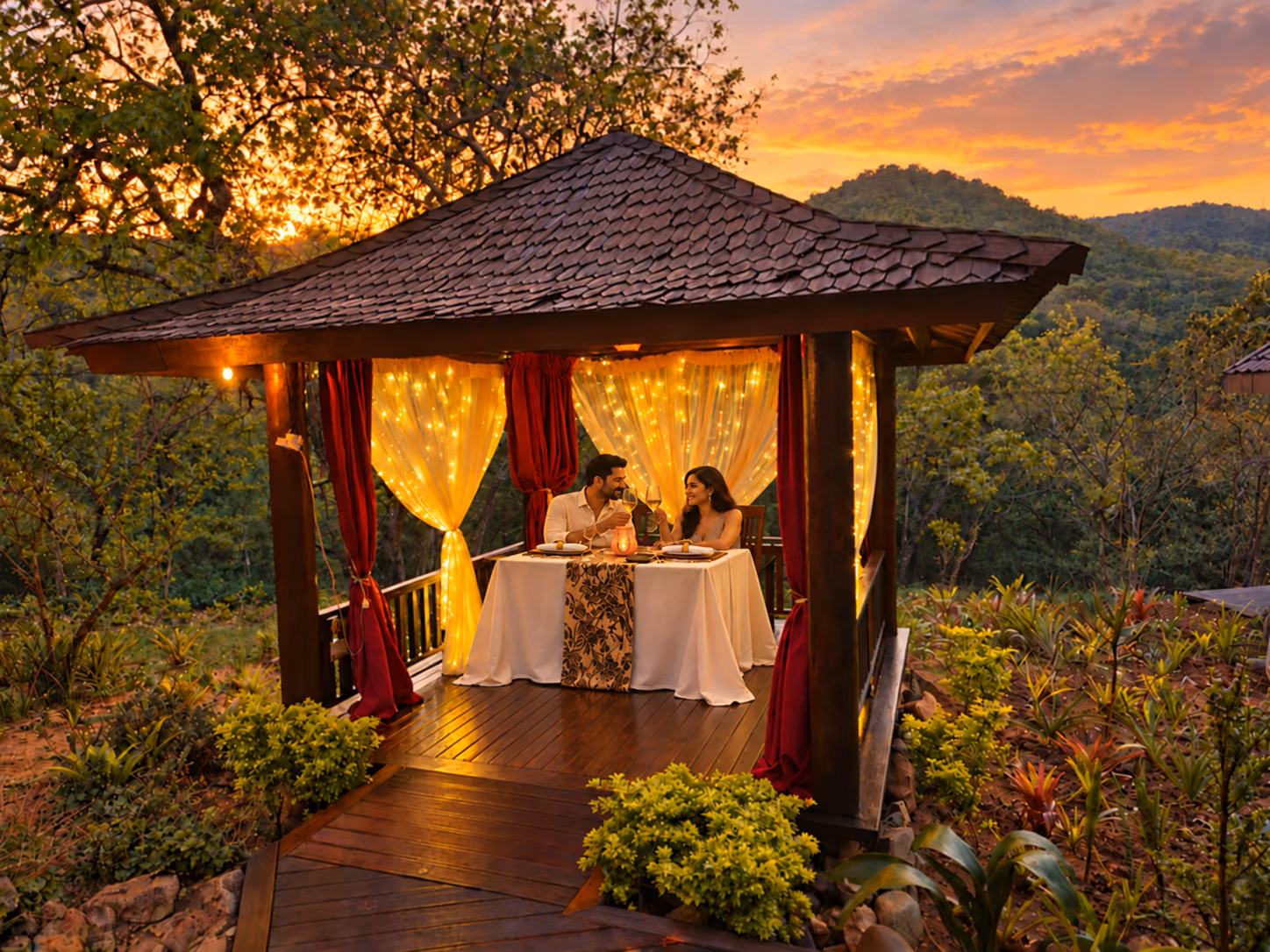 Dinner for two in the curtained gazebo at sunset, with the hills of the Lowveld behind